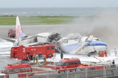 Japan Plane Fire
Firefighters try to extinguish smoke billowing from a China Airlines jet at Naha Airport in Okinawa Monday, Aug. 20, 2007. The China Airlines jet caught fire on the tarmac at the airport after arriving on a flight from Taipei on Monday, but none of the 155 passengers was injured, officials said. It was not immediately clear if any of the crew was hurt. (AP Photo/Okinawa Times, Katsuaki Kojya) ** JAPAN OUT NO SALES MANDATORY CREDIT ONLINE OUT **
